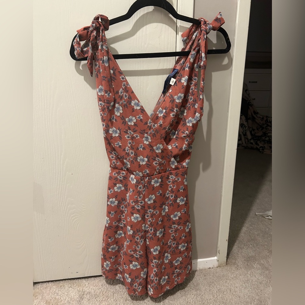 Dusty rose romper with blue flowers